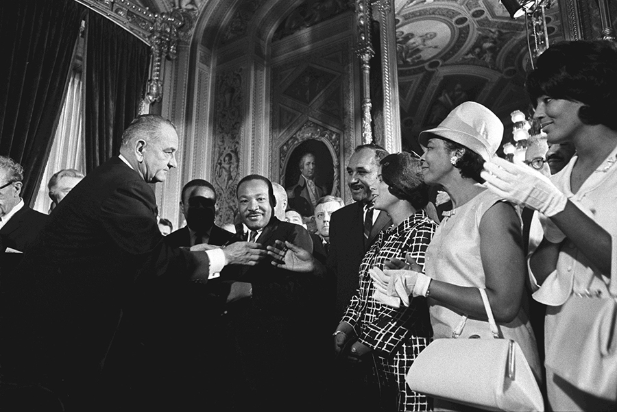 President Lyndon Johnson with Martin Luther King, Jr. and supporters