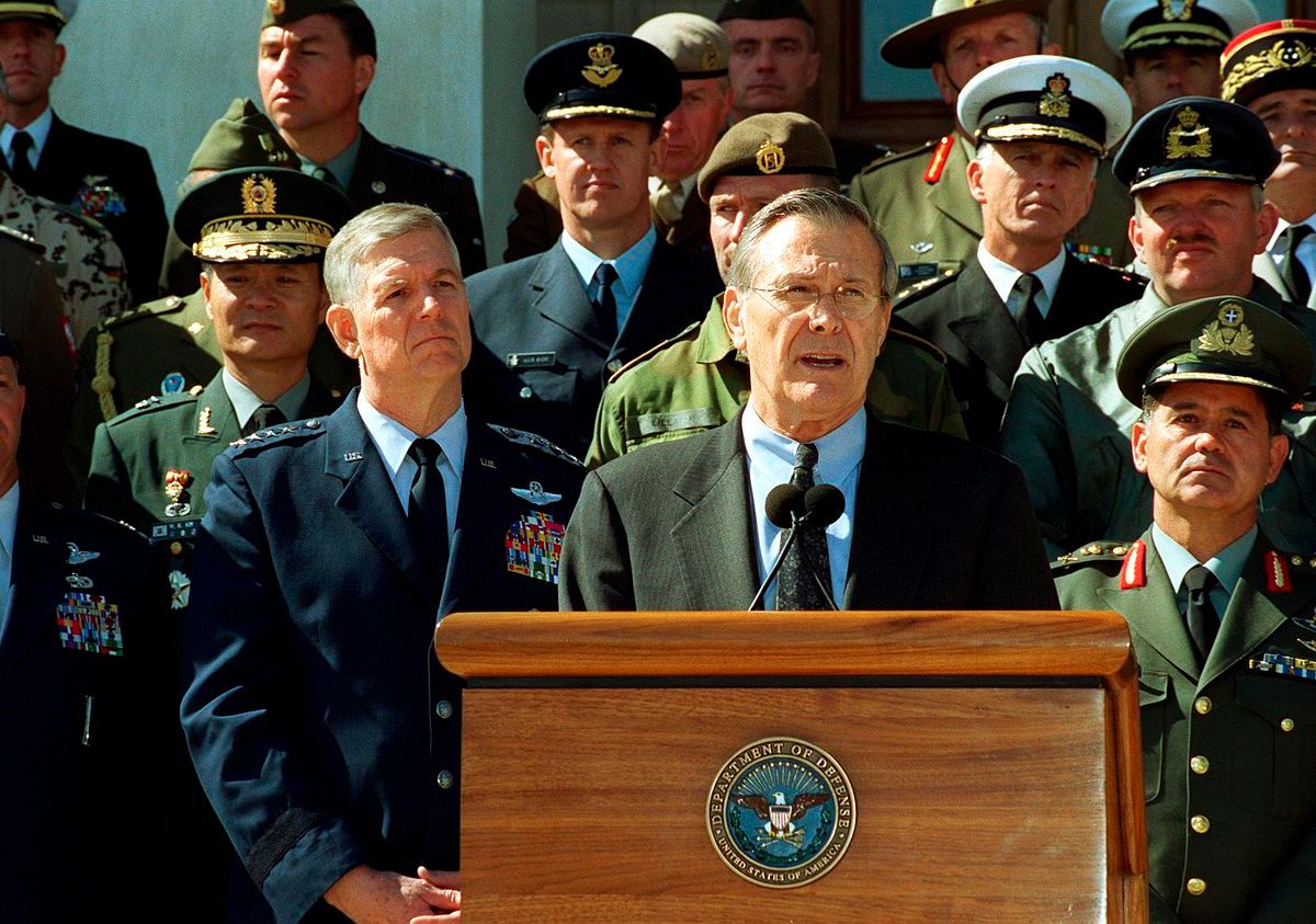 Secretary of Defense Donald Rumsfeld accompanied by Chairman of the Joint Chiefs of Staff General Richard B. Myers and joined by military representatives from 29 countries of the worldwide coalition on the war against terrorism, while speaking to the reporter outside The Pentagon on March 11, 2002.