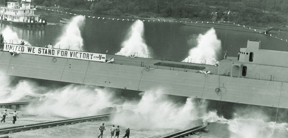 A spanking new LST slides down the ways at Pittsburgh’s Neville Island Shipyard, on the Ohio River. From there, it would travel downriver to New Orleans to be fitted out. (United States Naval Institute)