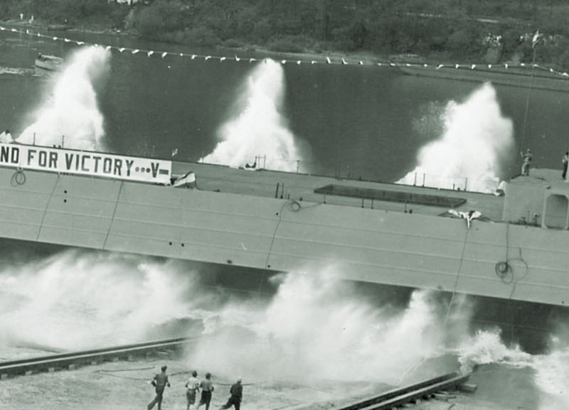 A spanking new LST slides down the ways at Pittsburgh’s Neville Island Shipyard, on the Ohio River. From there, it would travel downriver to New Orleans to be fitted out. (United States Naval Institute)