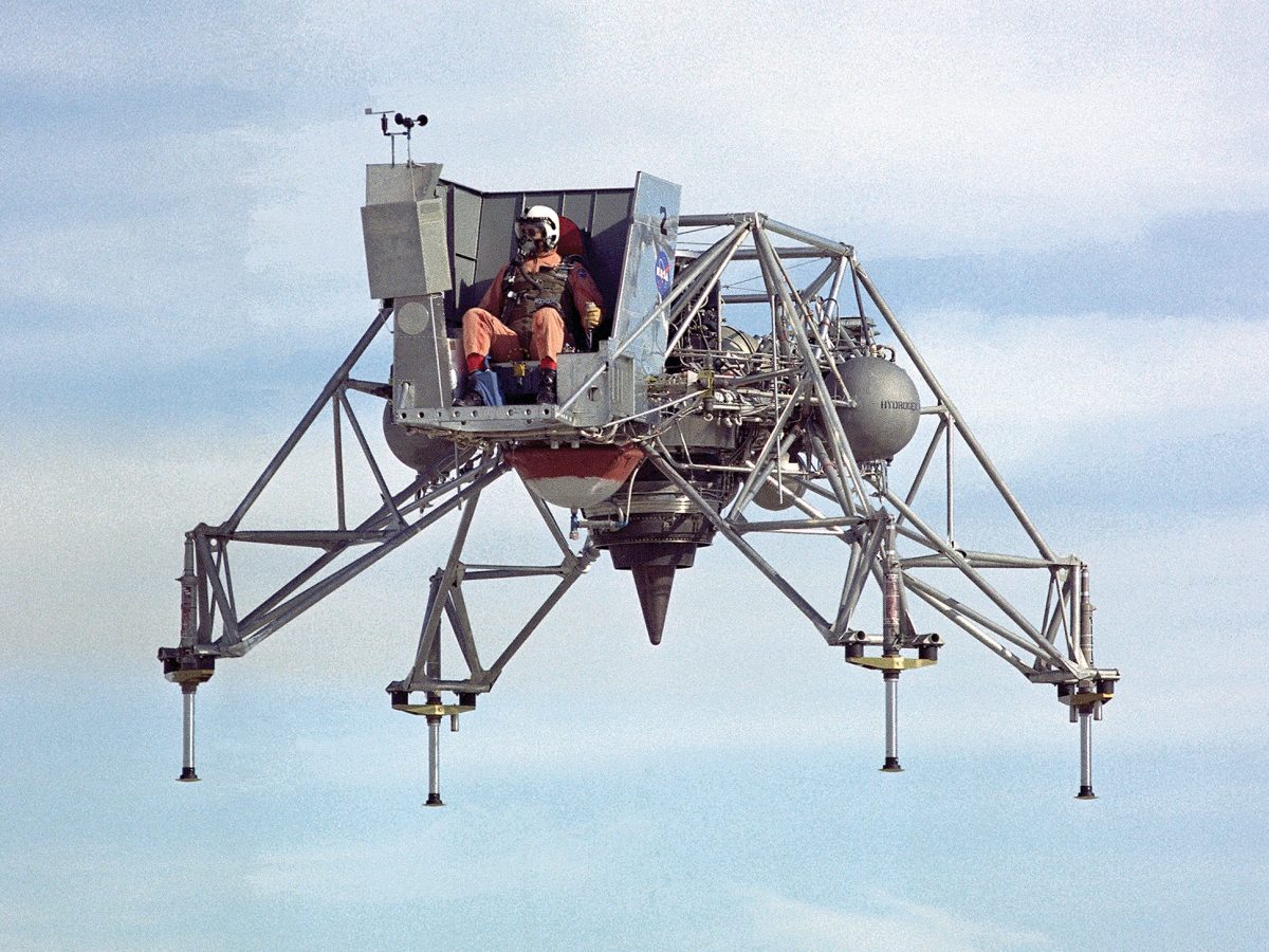 An astronaut trains for a prospective moon landing in a Lunar Landing Research Vehicle (LLRV) at the NASA Flight Research Center in 1967.