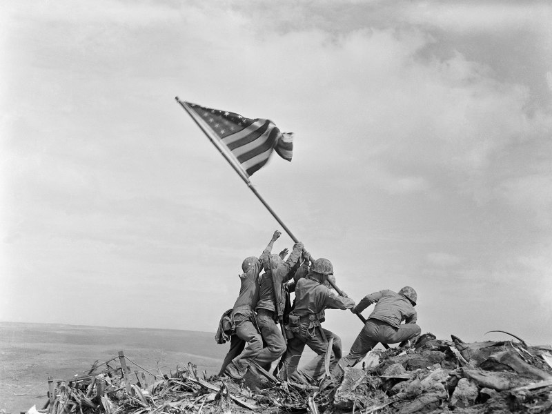 U.S. Marines raise the flag on Mount Suribachi.