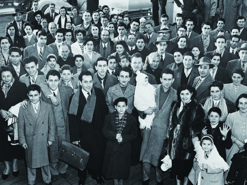 Immigrants arriving in New York from Genoa, Italy, on the deck of the liner SS Conte Giancamano at Christmas 1953. (Bettmann/Getty Images)