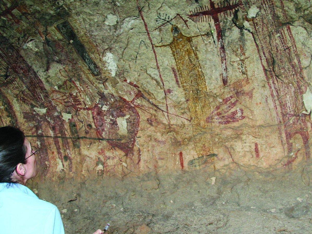 Archaeologist Carolyn Boyd studies a drawing in Panther Cave in Seminole Canyon State Park, Comstock, Texas. (AP Photo/Michael Graczyk)