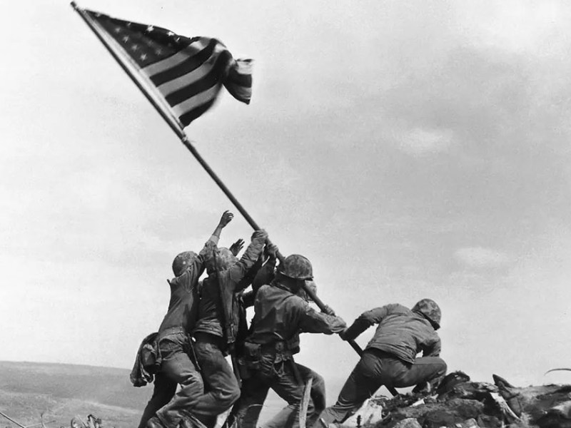 Col. Dave Severance, Company Commander of Easy Company of the 28th Marines, 5th Marine Division, became associated with a historic moment in American history on Feb. 23, 1945, when he responded to orders from his battalion commander to send a patrol to Mount Suribachi, the highest summit on the island described by Marine Lt. Gen. Holland M. “Howlin’ Mad” Smith as a “grim, smoking rock.” Following orders from the battalion commander, the platoon hoisted an American flag on the summit. But it wasn’t the famed image captured by Associated Press photographer Joe Rosenthal. The Secretary of the Navy James V. Forrestal, upon seeing the first flag raised on Mount Suribachi, wanted to keep it as a memento. Thus a second larger flag was raised to replace it, which Rosenthal went on to document to much acclaim. (USMC)