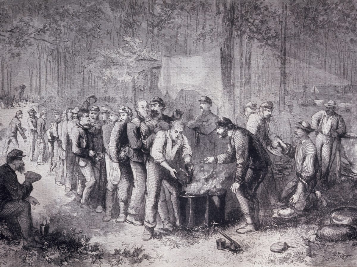 Soldiers being served vegetable soup