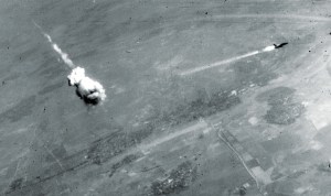 SA-2 surface to air missile F-105 trailing smoke just after interception by an SA-2. The SA-2 did not actually hit an aircraft—the fuse automatically went off when it neared the target, throwing deadly fragments over a wide area. (U.S. Air Force photo)
