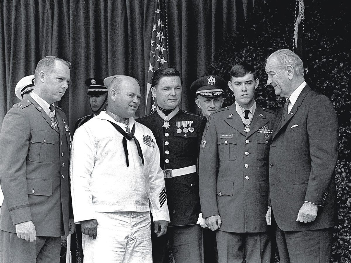 President Lyndon Johnson, right, poses May 14, 1968 at the White House with four winners of the nation's highest award, the Medal of Honor. Decorated for valor in Vietnam, they are, from left: Air Force Capt. Gerald O. Young, of Anacortes, Wash.; Navy Bosn"s Mate James E. Williams, of Rock Hill, S.C.; Marine Sgt. Richard A. Pittman, of Stockton, Calif. and Army Spc. 5 Charles C. Hagmeister, of Lincoln, Neb. Others are unidentified. (AP photo)