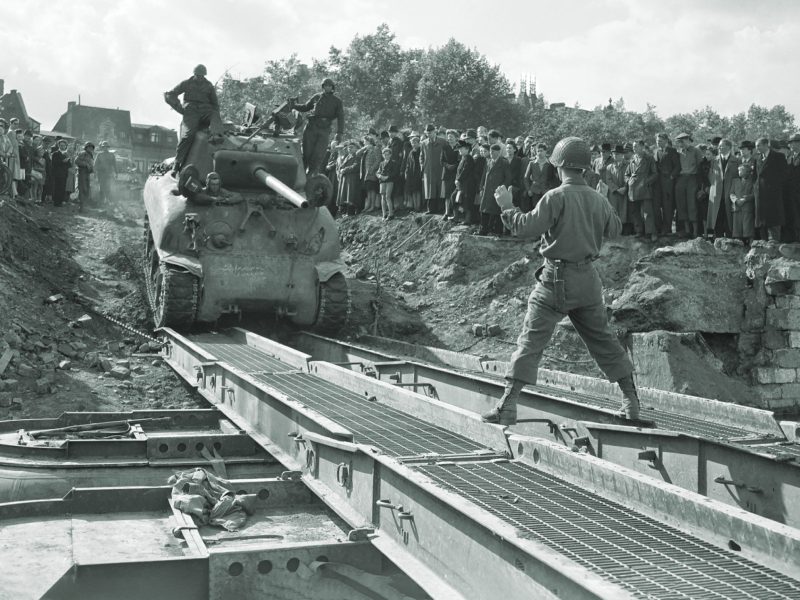 war-daddy-crosses-pontoon-bridge-in-belgium