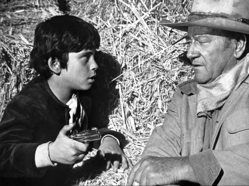 Ethan and father John Wayne in a still from the 1971 Western Big Jake