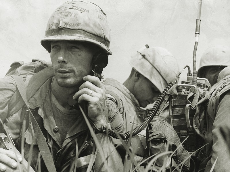 Photo of 1967: A Platoon Commander from the United States 1st Marine Division using a radio during operations in Vietnam. (Photo by Three Lions/Getty Images)