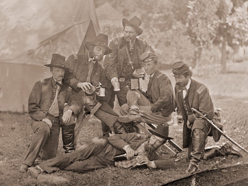 Group of Union officers drinking liquor in camp