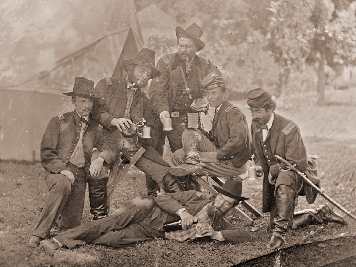 Group of Union officers drinking liquor in camp