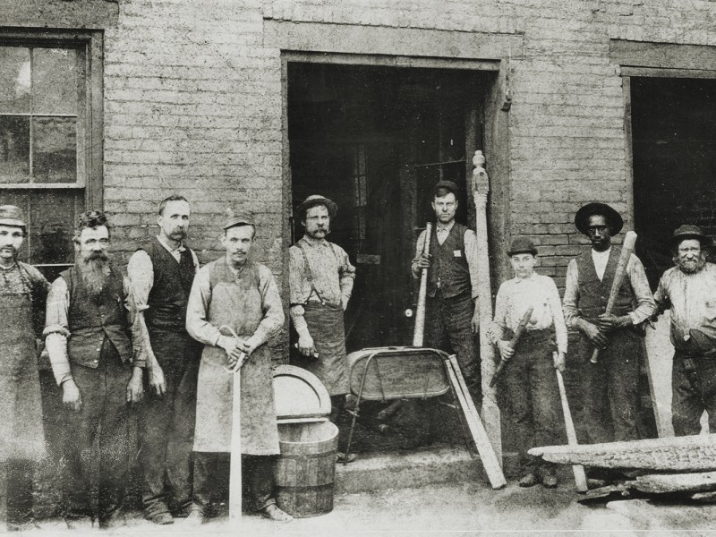 Photo of workers at the Louisville Slugger Factory.