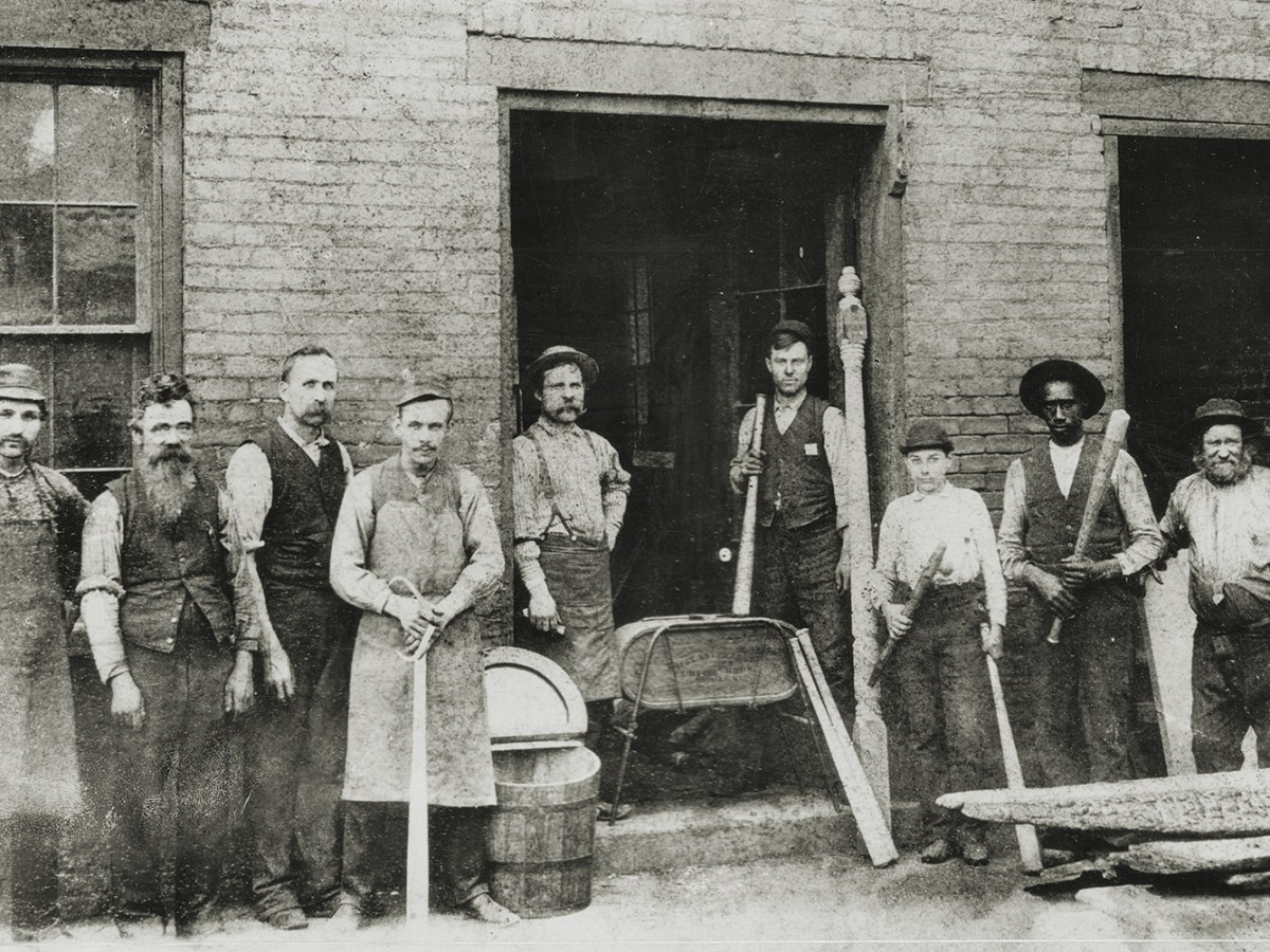 Photo of workers at the Louisville Slugger Factory.