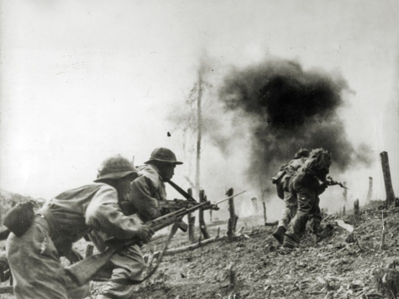 Photo of North Vietnamese troops during an assault on a South Vietnamese paratroop base at Laos during the Vietnam War.
