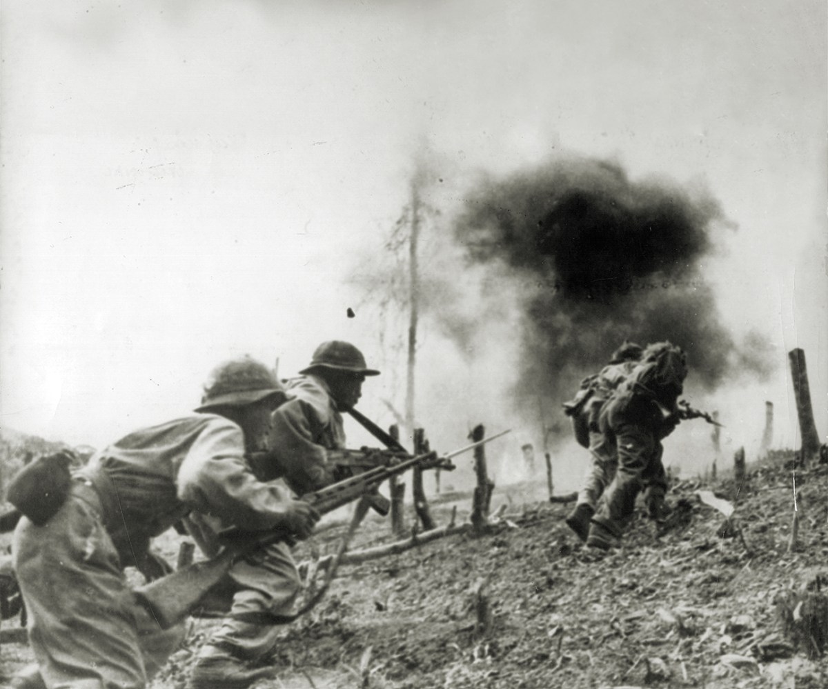 Photo of North Vietnamese troops during an assault on a South Vietnamese paratroop base at Laos during the Vietnam War.