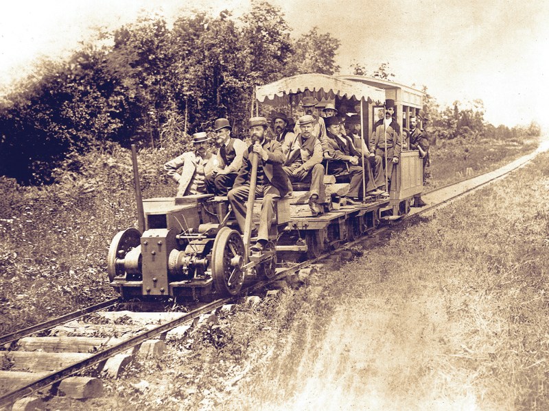 Photo of men testing an electric train in Thomas Edison experimental laboratory. Menlo Park, 13th May 1880.