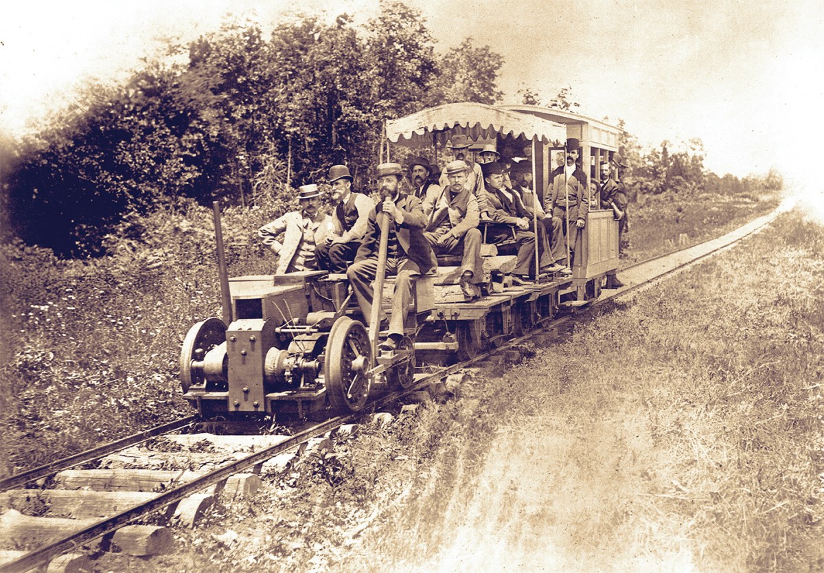 Photo of men testing an electric train in Thomas Edison experimental laboratory. Menlo Park, 13th May 1880.