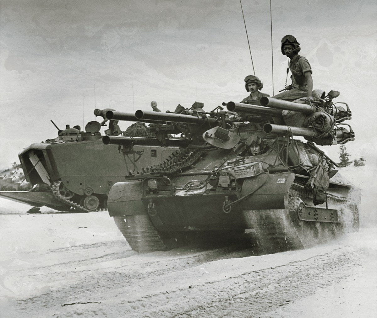 Photo of American forces on Chu Lai beach searching for a defensive position shortly after descending from the landing crafts aboard the USS Thomaston. Vietnam, June 1965.
