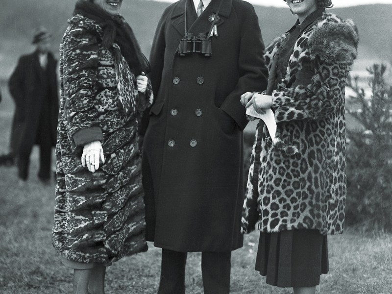 Photo of American financier and president of the New York Stock Exchange Richard Whitney poses with his wife Gertrude (nee Sheldon Sands) and his daughter Nancy at an unidentified event, 1934.