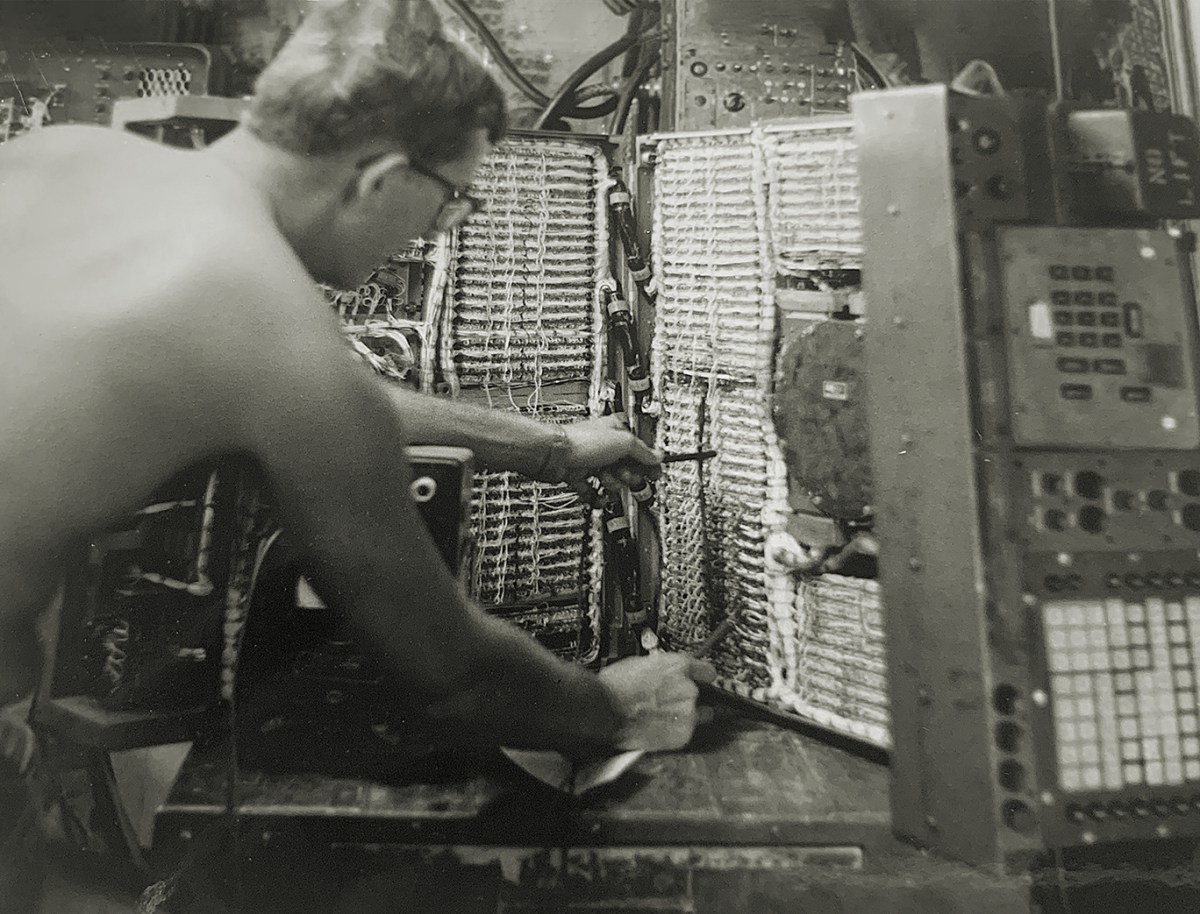Photo of, author Paul Ingevaldson working on an M18 Field Artillery Digital Automatic Computer (FADAC) used for gun targeting in Vietnam.