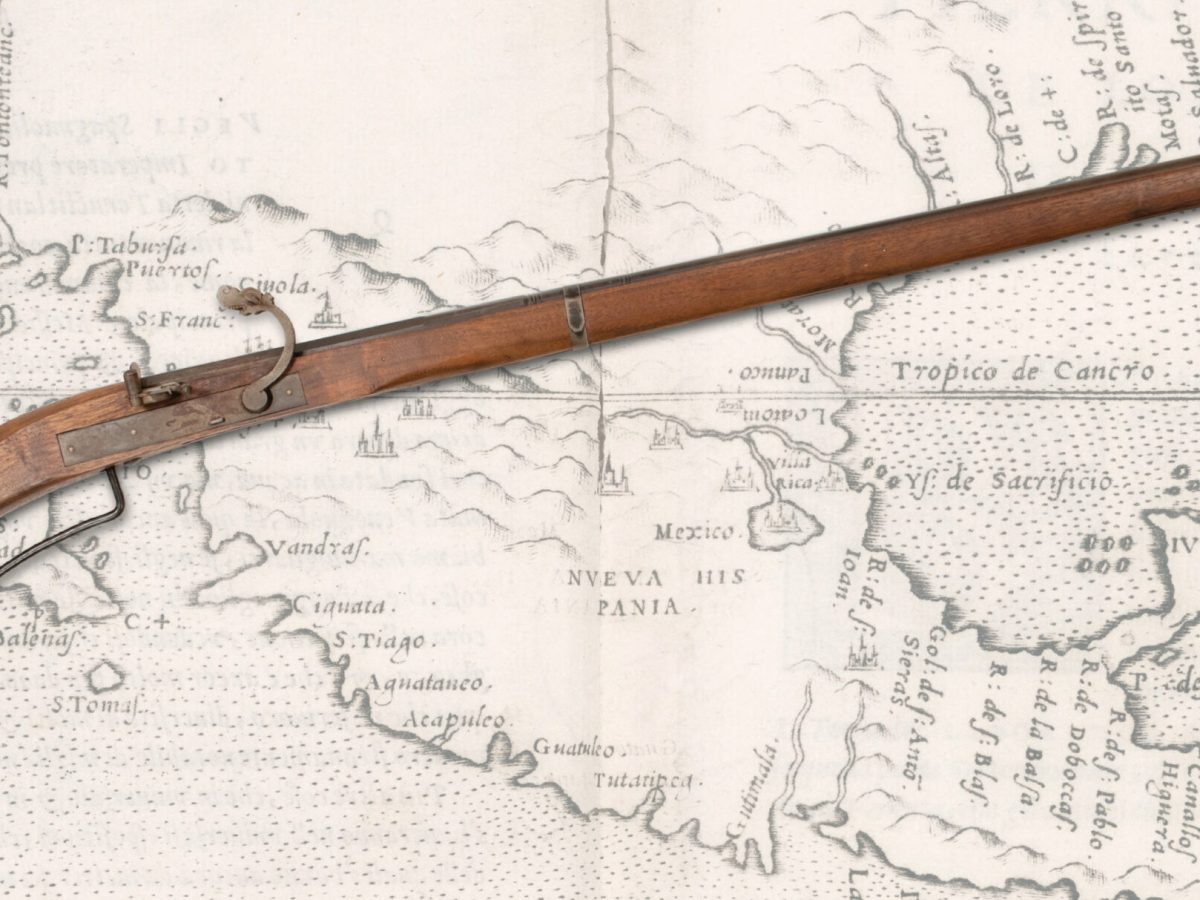 Spanish harquebus laid over map of North America