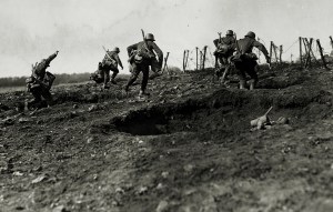 Photo of German storm troops laden with equipment have to advance over open but broken ground. The enemy know of their approach because of a preliminary barrage.