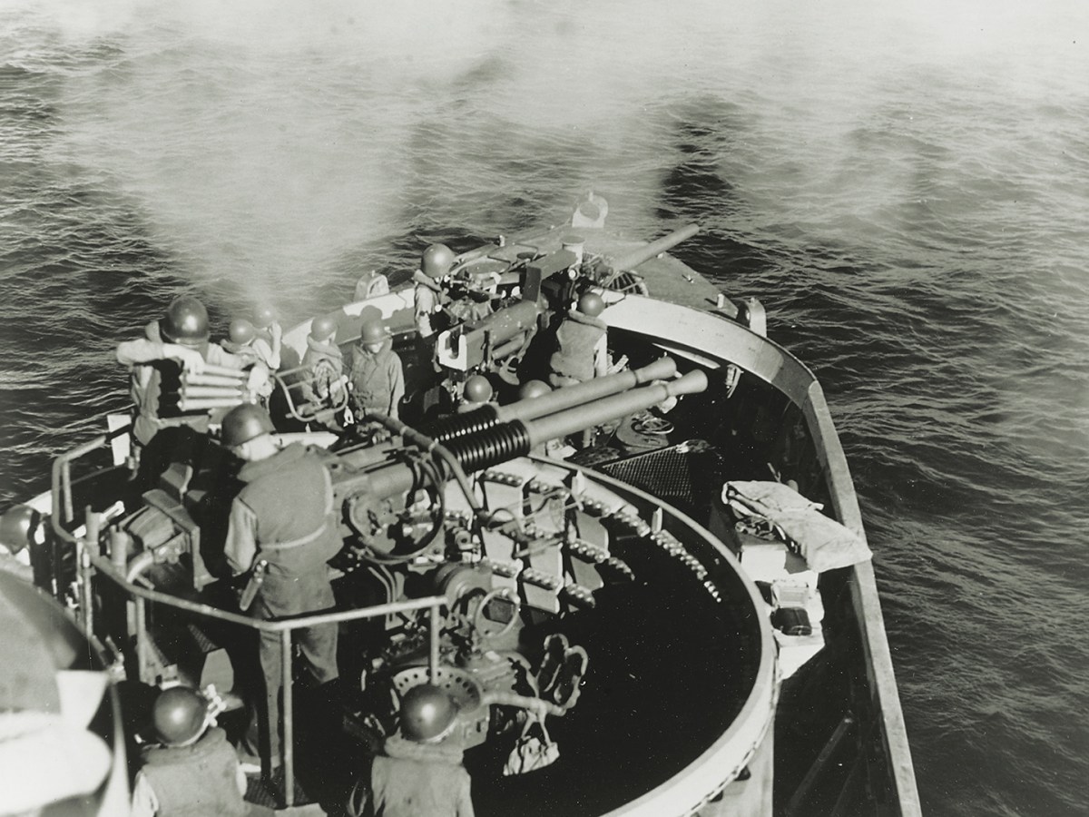 Photo of a LCS fairly bristled with guns, including the twin Bofors 40 mm L/60 antiaircraft guns and Mark 22 3-inch/50-caliber bow gun shown here in action off the Philippines in 1945.