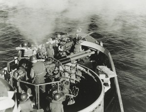 Photo of a LCS fairly bristled with guns, including the twin Bofors 40 mm L/60 antiaircraft guns and Mark 22 3-inch/50-caliber bow gun shown here in action off the Philippines in 1945.